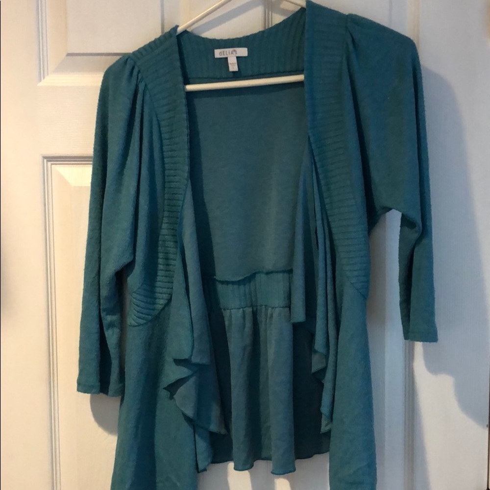 Delia’s teal cardigan